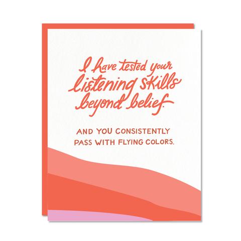 Red handwritten text on white card, reading: I have tested your listening skills beyond belief and you consistently pass with flying colors
