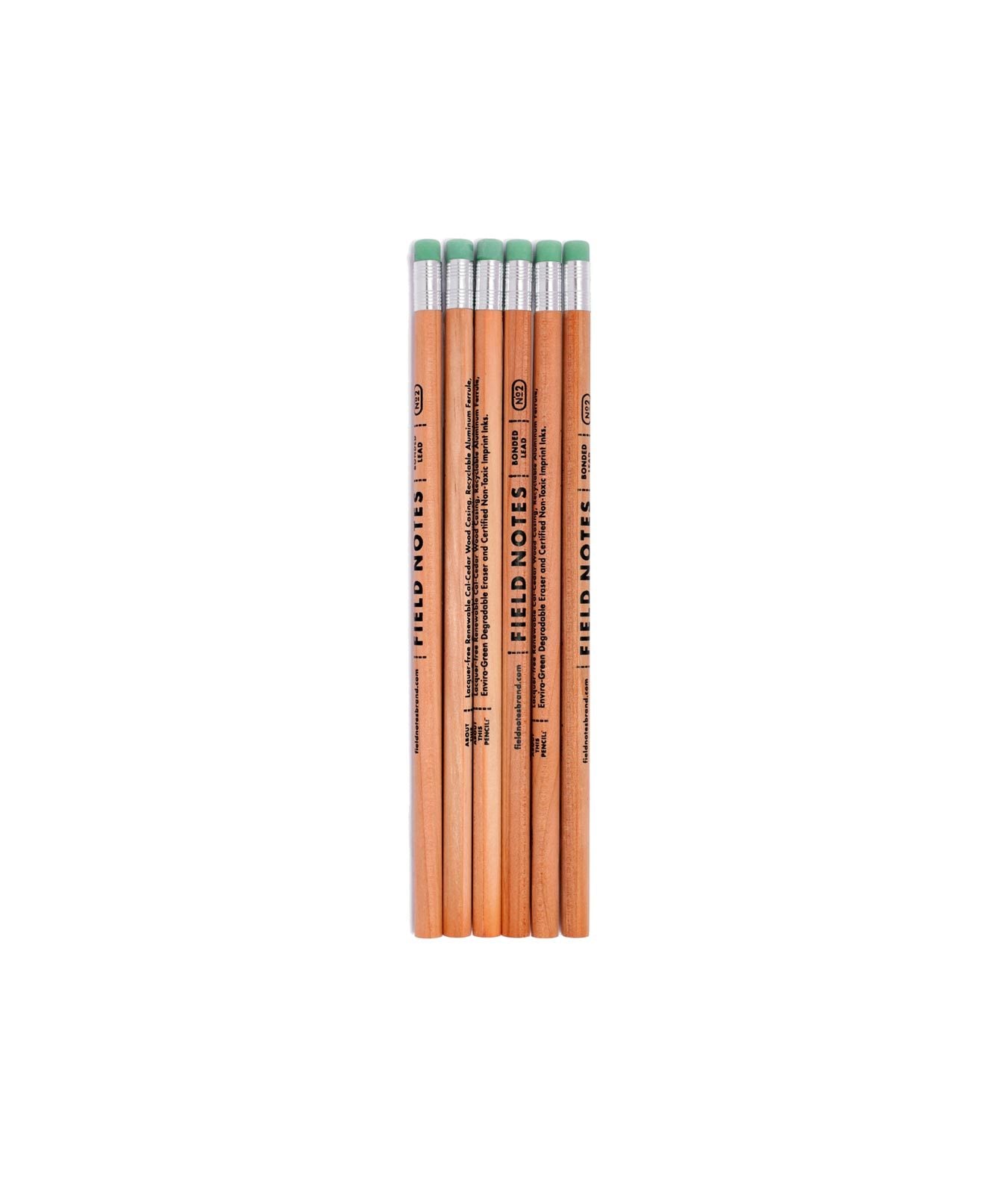 6 natural wood finish pencils with aluminum ferrules and green erasers. Stamped with Field Notes logo in black ink.